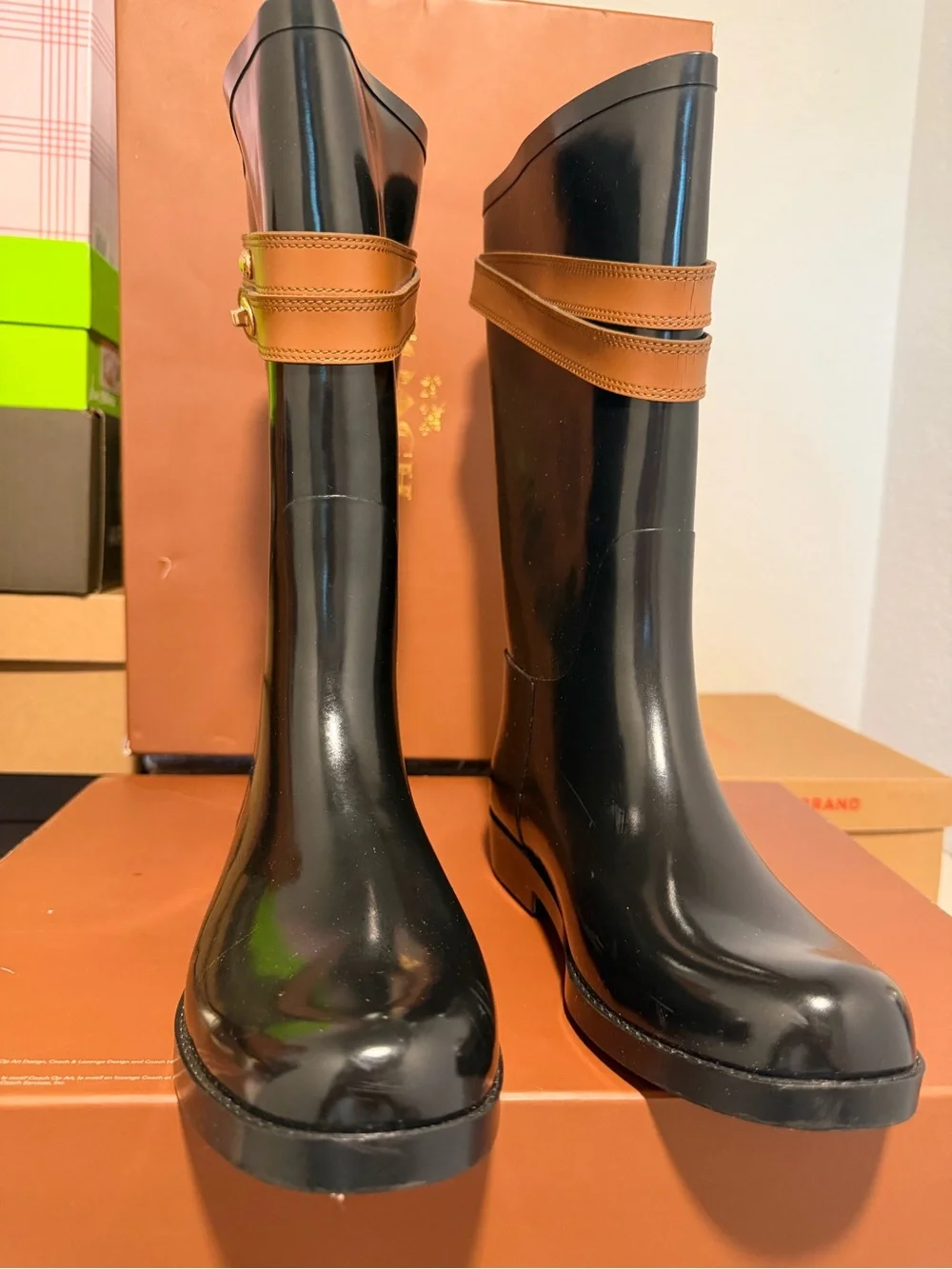 Coach Black Rain Boots with Tan Strap and Gold Accent